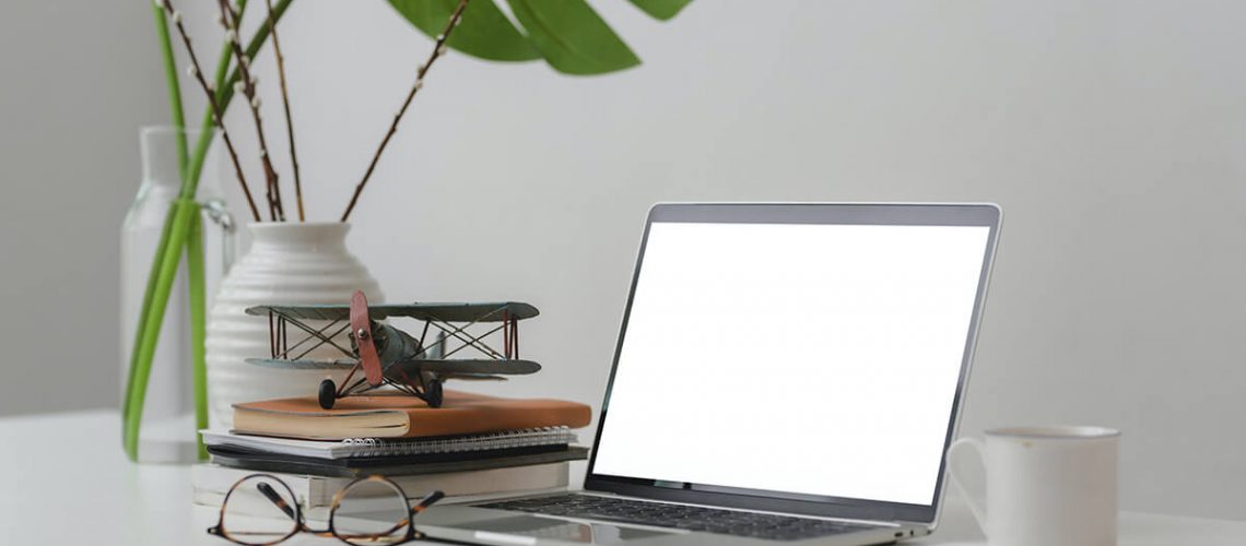 Small - macbook-pro-on-white-table-3816195